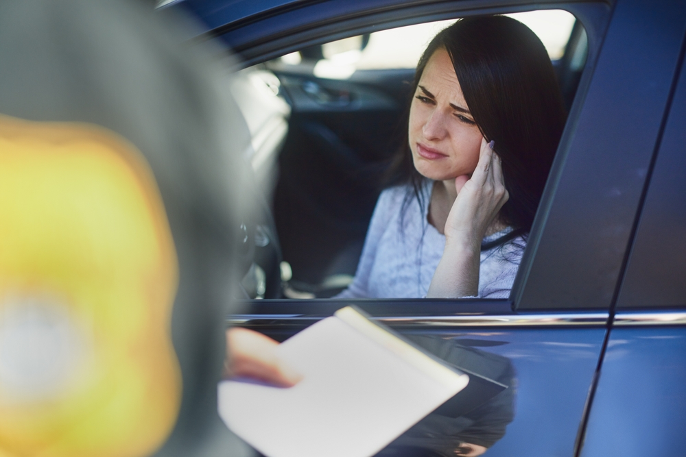 A woman being pulled over by a police officer wonders, “What is a blood test for DWI in Texas?”